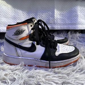 black and white jordan’s with orange sole